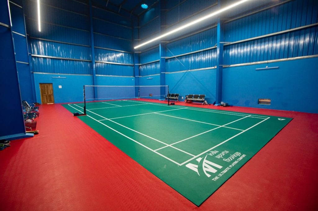 Synthetic badminton court flooring